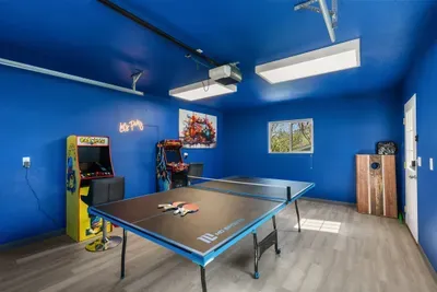 Game room with ping pong table and 2 arcades!
