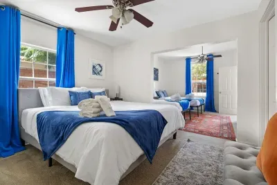 Bedroom 4 and 5 (up close you can see bedroom 4 with a king bed and towards the back of this photo you see bedroom 5 (there is no door between the two). There is an ensuite bathroom.