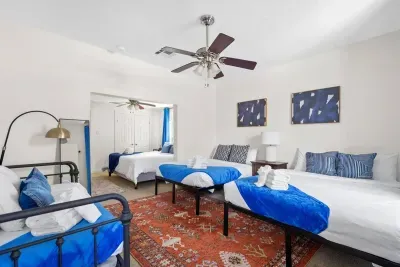 Bedroom 4 and 5 (up close you can see bedroom 4 with a king bed and towards the back of this photo you see bedroom 5 (there is no door between the two). There is an ensuite bathroom.