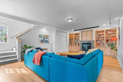 The tv is in the cabinet above the gas fireplace