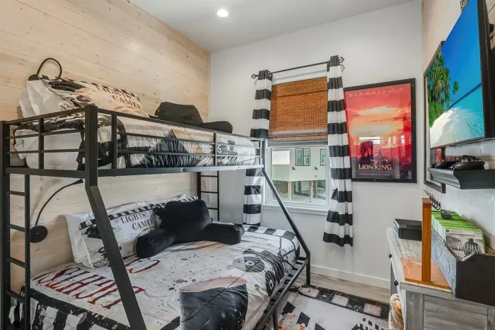 Kids room with bunk beds and xbox