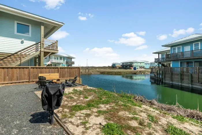 Waterfront fire pit with cozy seating

