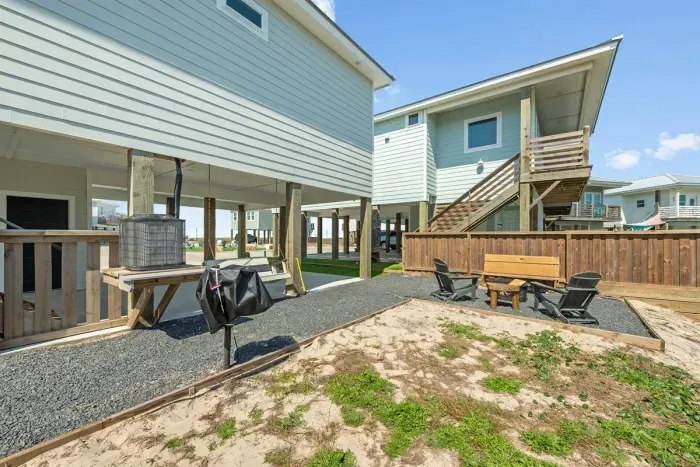 Large, outdoor space with seating and park style grill
