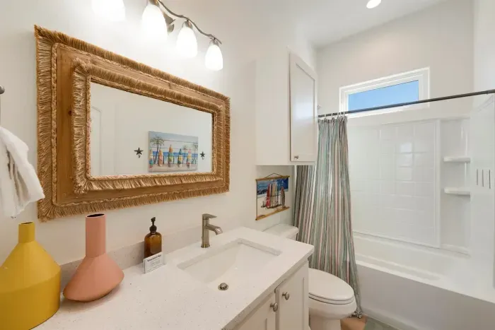 Large hallway bathroom for bunk room and hallway bedroom with king bed