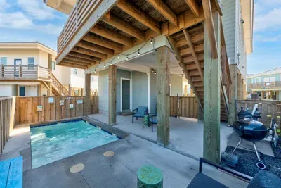 Large outdoor area with seating, half bathroom and BBQ Grill