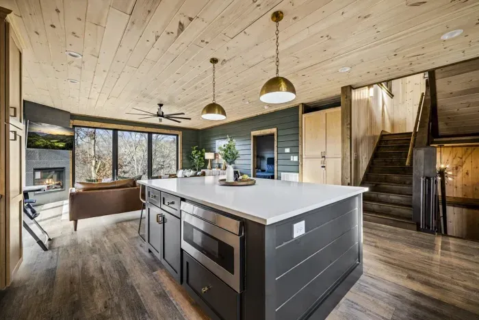  This forest-view retreat blends rustic charm with modern comfort