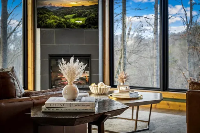 Curl up by the fire with forest views and curated comfort.