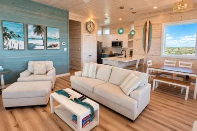 open concept living, dining and kitchen area