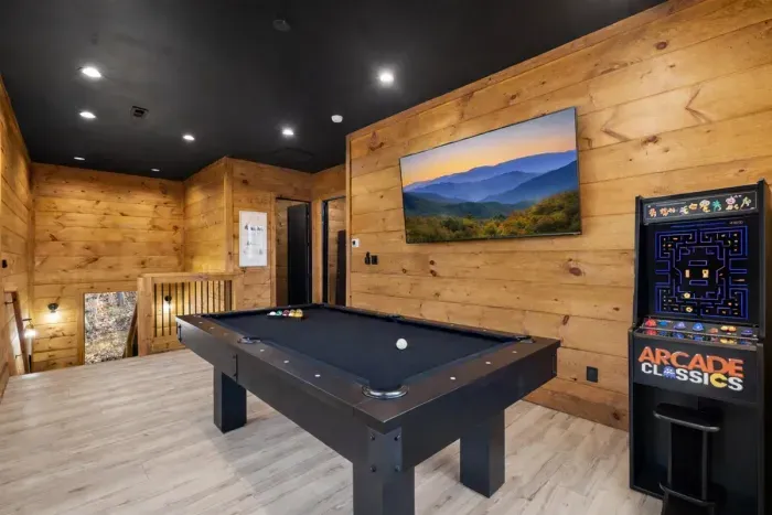 Game room with pool table TV, and 60 game multicade.