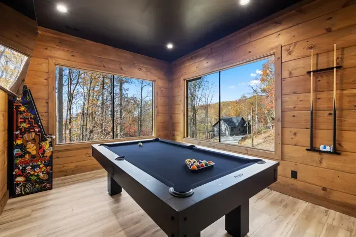 Game room with pool table and 60 game multicade