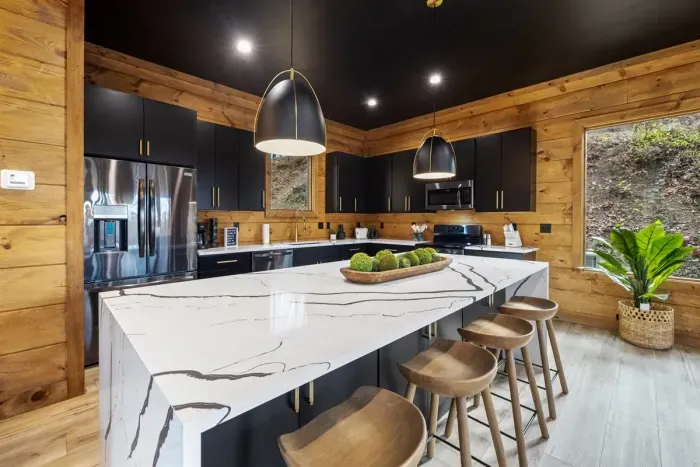 Chef's kitchen with bar seating for 4 people