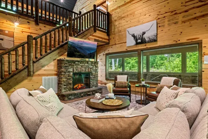 Living area with large window that overlooks indoor pool