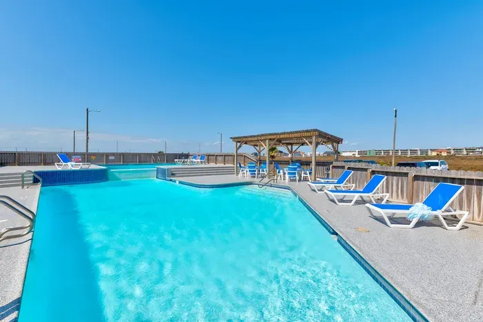 Inviting poolside retreat under blue skies
