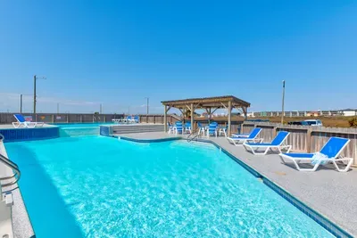 Relaxing poolside escape with unique design and coastal charm