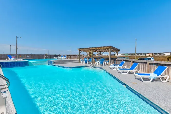 Relaxing poolside escape with unique design and coastal charm