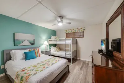 Second bedroom with a queen bed and a twin over twin bunk bed
