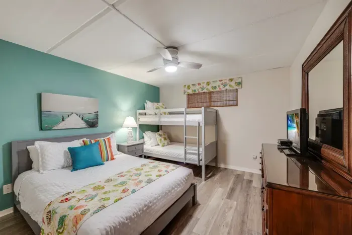 Second bedroom with a queen bed and a twin over twin bunk bed