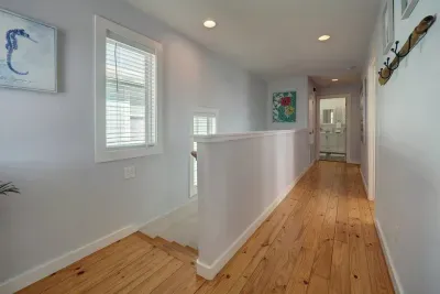 Upstairs has three bedrooms and two full bathrooms
