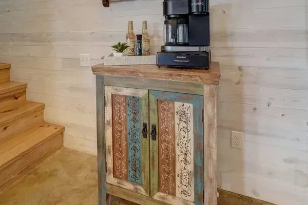 Coffee bar with drip coffee machine and Keurig. We also include creamers, coffee, filters, and Keurig cups.