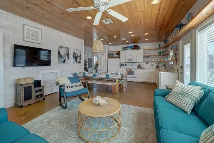 Open concept living, dining and kitchen area.