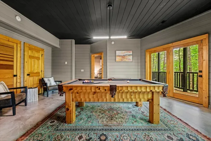 Game Room with sitting area, pool table, TV & arcade