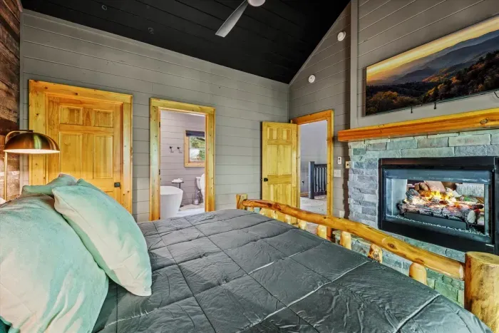 King bedroom with gas fireplace