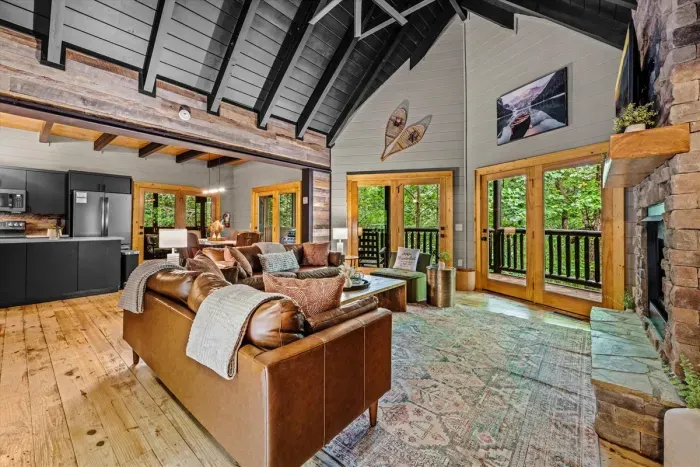 Large living area with ample seating and cathedral ceilings