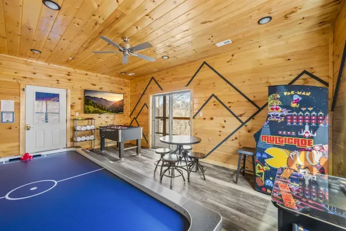 Game room with foosball, air hockey and two multitudes