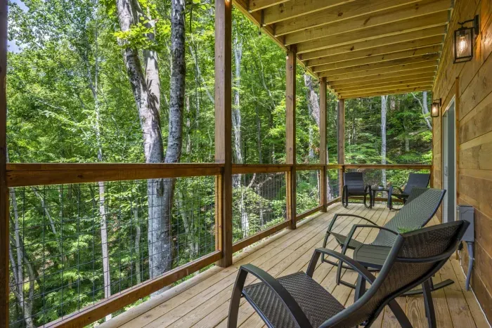 One of three deck areas looking out into a wooded area