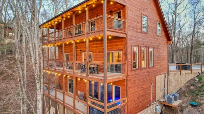 Three decks overlooking wooded area