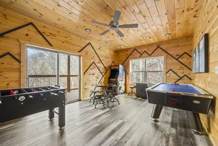 Game room with foosball, two multitudes & air hockey