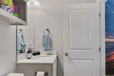 One of three full bathrooms