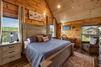 Upstairs bedroom with king bed and large ensuite bathroom