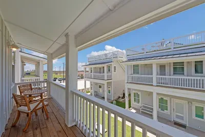 Second floor balcony overlooking the turfed front lawn