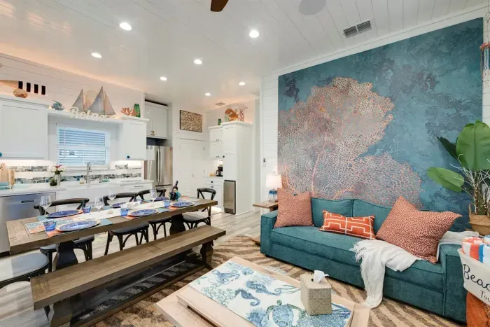 Professionally decorated living area with beach themed mural