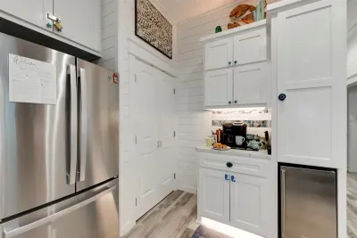 Coffee bar stocked with k cups, sweeteners, creamers & hot chocolate. Plus Thor brand Ice Drawer
