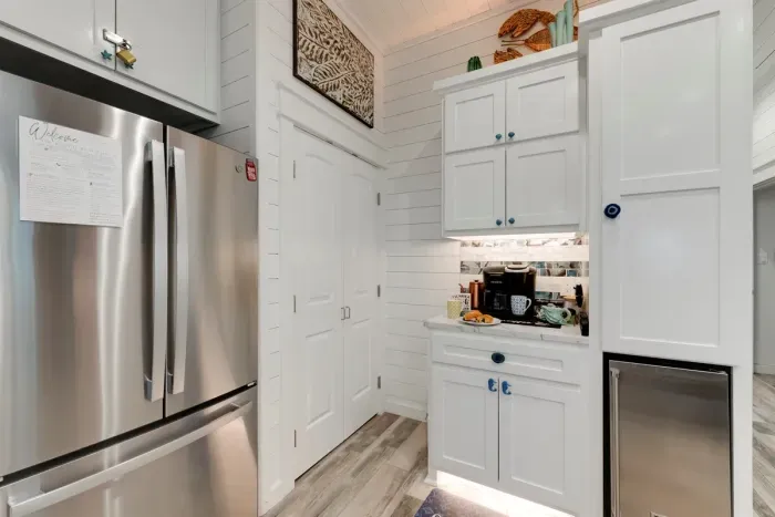 Coffee bar stocked with k cups, sweeteners, creamers & hot chocolate. Plus Thor brand Ice Drawer