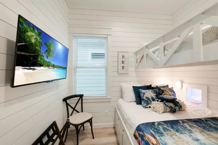 Bunk room with twin over queen beds plus TV