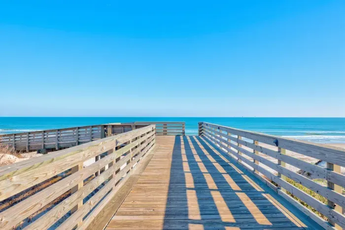 Steps away from the house is the private, golf cart friendly boardwalk to the beach