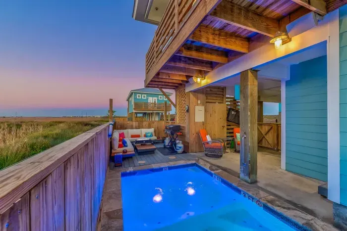 Private cocktail pool, seating area and views of the wetlands from the back porch
