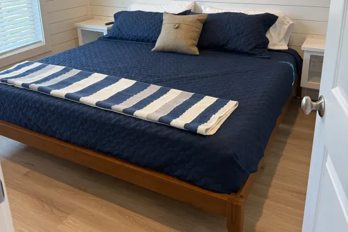 Your peaceful sanctuary—clean lines, soft linens, and total relaxation.