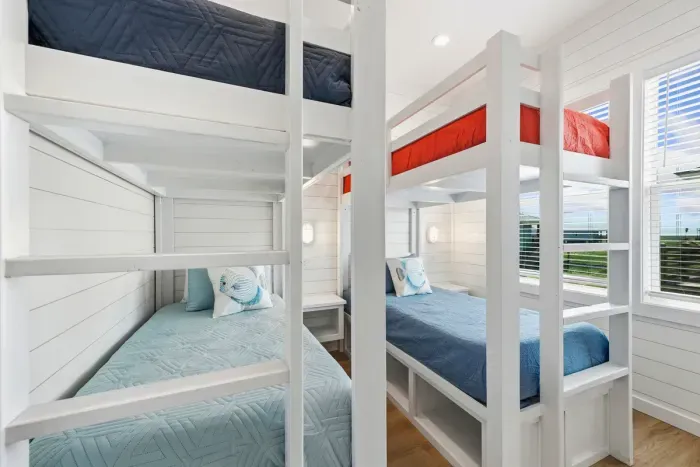 A smart, space-saving room that doesn't compromise on comfort. This cozy setup makes it easy to fit the whole crew together in one fun spot.
