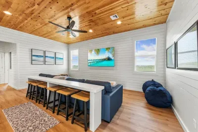 Designed for flexible living and extra entertainment space. Whether you need a quiet nook to set up a laptop or a casual spot to lounge on the beanbags, this room has a place for everyone