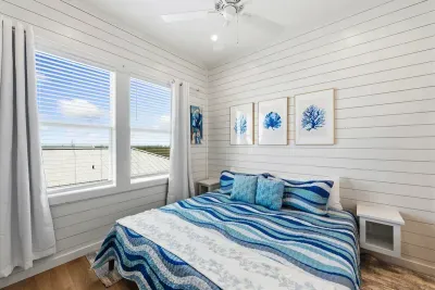 A beautifully styled room that offers a cozy, light-filled escape for your stay. Wake up to wide-open views and a bright, welcoming atmosphere every morning.