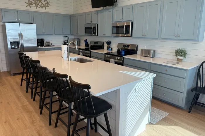 The true heart of the home, offering more than enough room for the whole group to gather, cook, and socialize together.