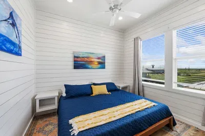 A welcoming bedroom that serves as your own quiet escape at the end of a busy day. It’s a beautifully bright and airy space that helps you instantly ease into vacation mode.