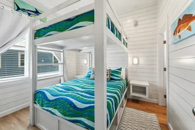 Maximize your group’s comfort without sacrificing style or space. This cheerful, light-filled room offers a cozy tucked-away feel that's perfect for a restful night's sleep.