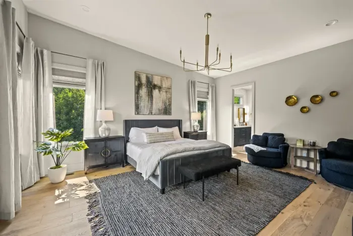 One of two Primary bedrooms on main floor with King bed and ensuite bathroom.