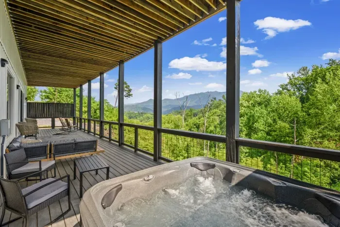 Soak by the hot tub and enjoy the views from the bottom deck.