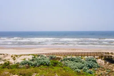 Boardwalk to the beach located directly in front of the house.